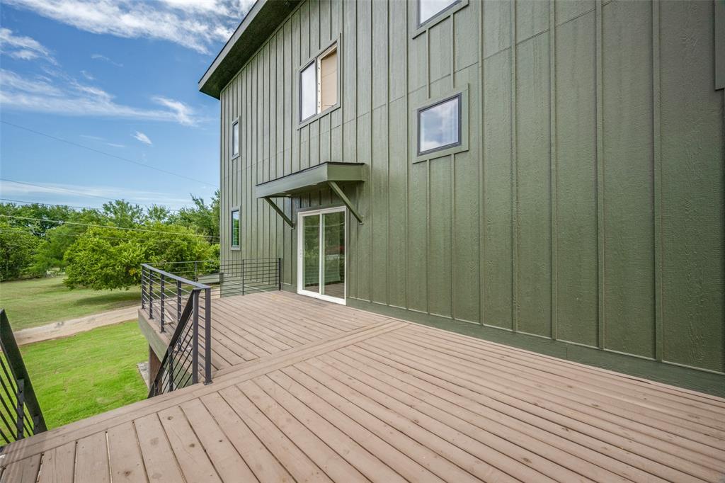614 Twin Hills Road Lake Bridgeport, TX 76426 - Photo 5 of 25 a view of a house with backyard and deck