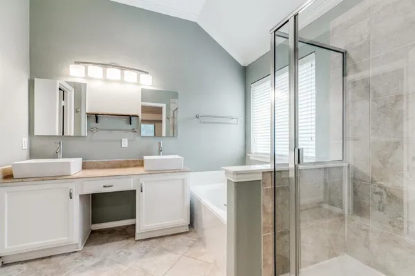 a view of a double vanity sink and a mirror in a bathroom