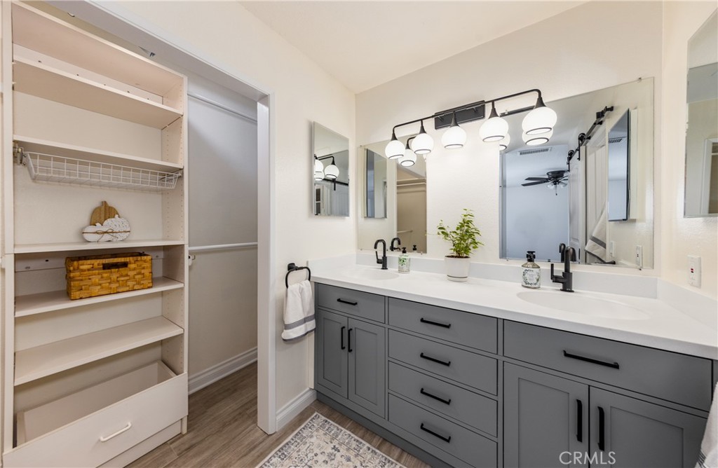 12780 Blossom Avenue Yucaipa, CA 92399 - Photo 14 of 31 a spacious bathroom with a double vanity sink and a mirror