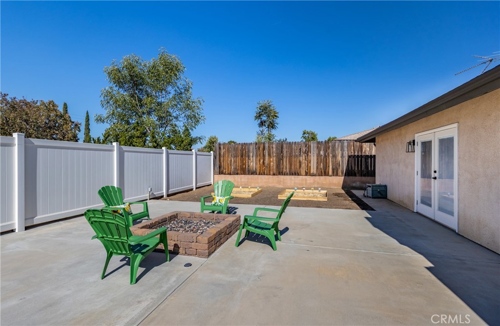 12780 Blossom Avenue Yucaipa, CA 92399 - Photo 23 of 31 a view of backyard with a table and chairs