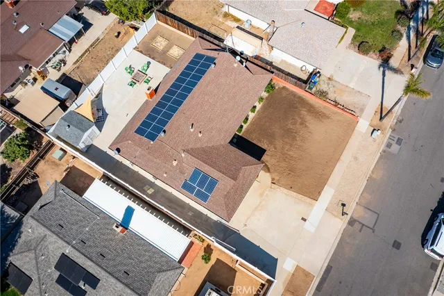 an aerial view of a house with a pool