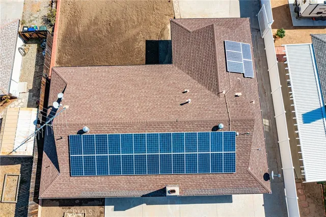 an aerial view of residential houses and outdoor space