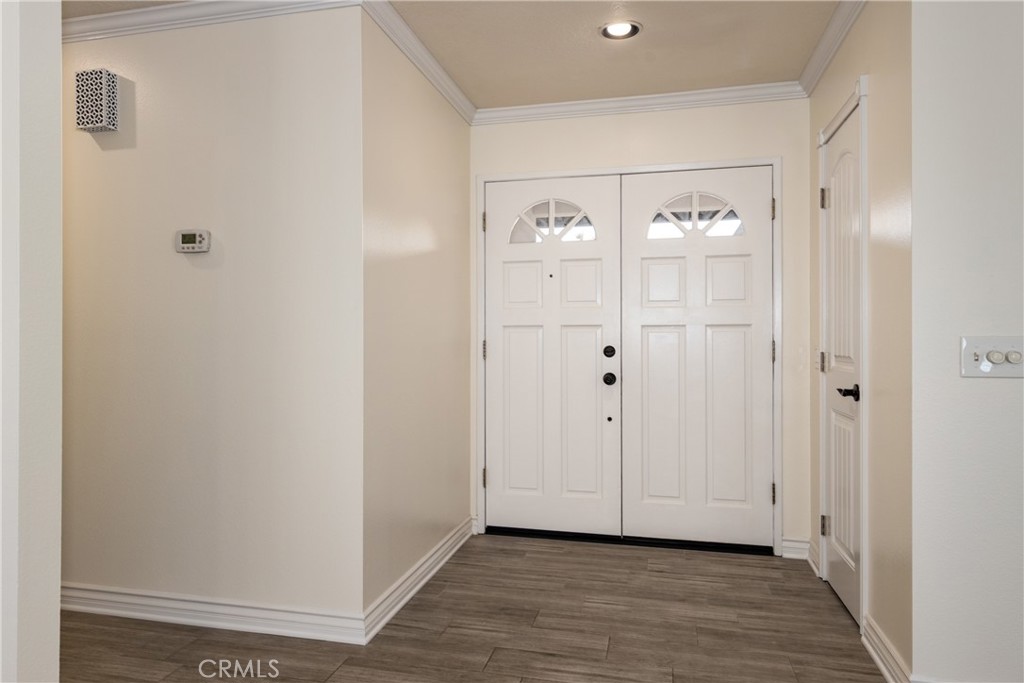 12780 Blossom Avenue Yucaipa, CA 92399 - Photo 4 of 31 a view of a hallway with wooden floor