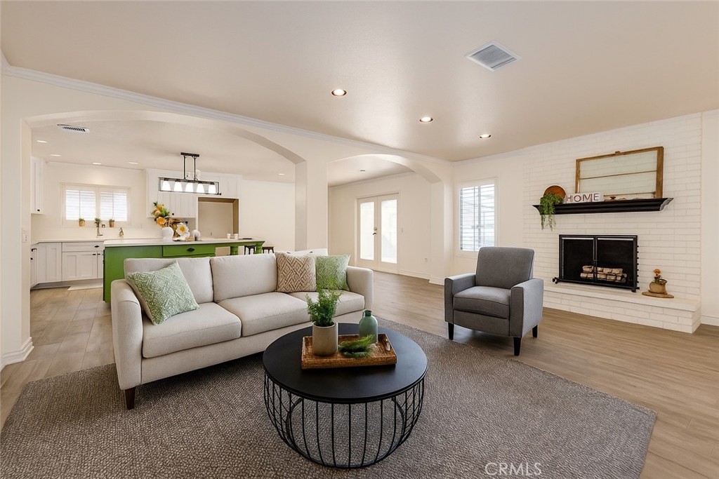 12780 Blossom Avenue Yucaipa, CA 92399 - Photo 6 of 31 a living room with furniture a rug and a fireplace
