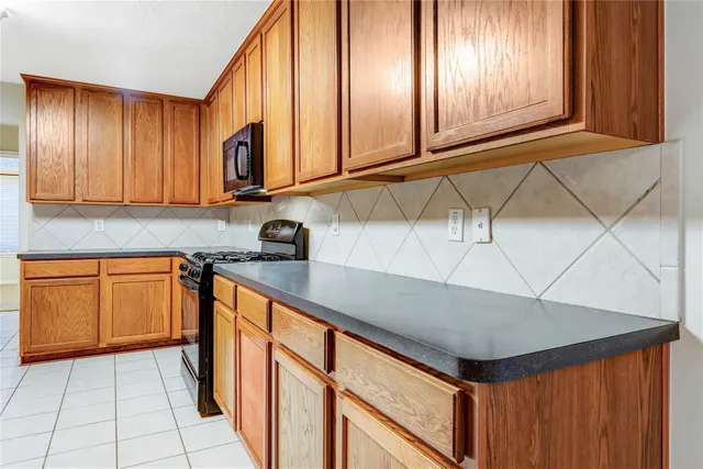 a spacious bathroom with a granite countertop sink and a mirror