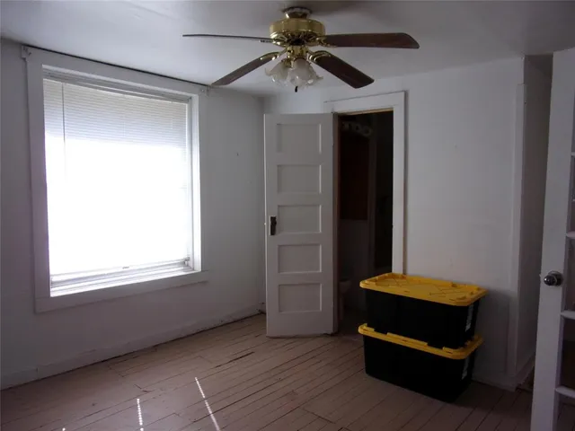 a room with a bed and a window