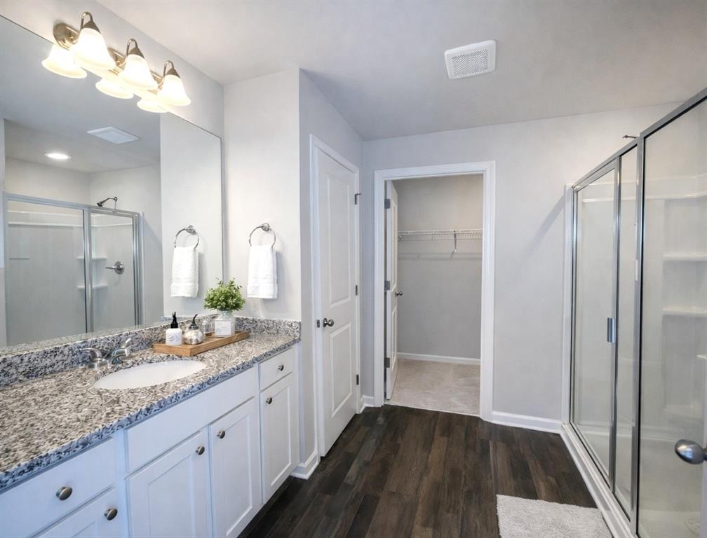 6359 Towhee Way Morrow, GA 30260 - Photo 6 of 36 a bathroom with a double vanity sink and a mirror