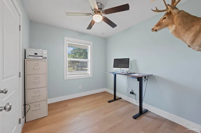 a view of an entryway with wooden floor