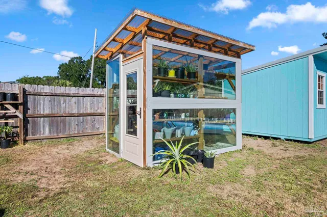 a view of swimming pool with an outdoor seating