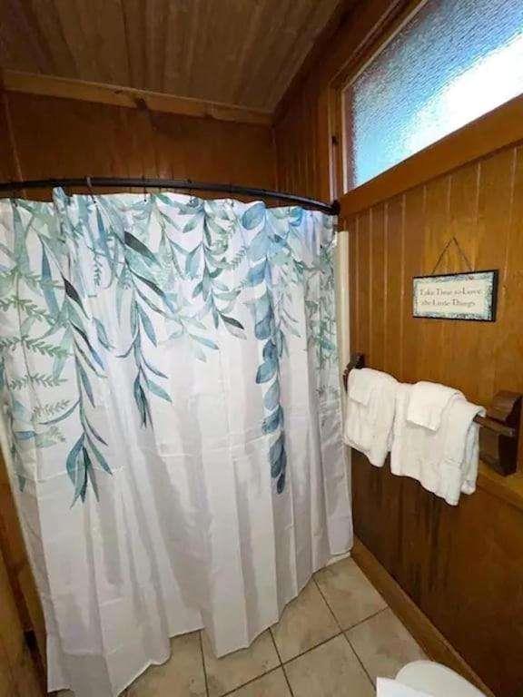 496 Beaver Dam Road Dahlonega, GA 30533 - Photo 18 of 28 a bathroom with a sink and shower curtain