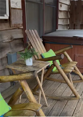 a view of backyard with a table and chairs