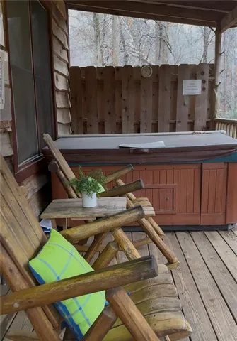 a view of a two chairs in the balcony