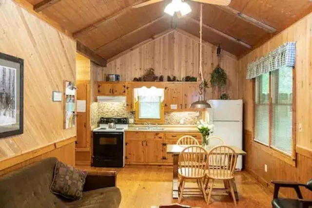 a kitchen with stainless steel appliances granite countertop a stove and cabinets