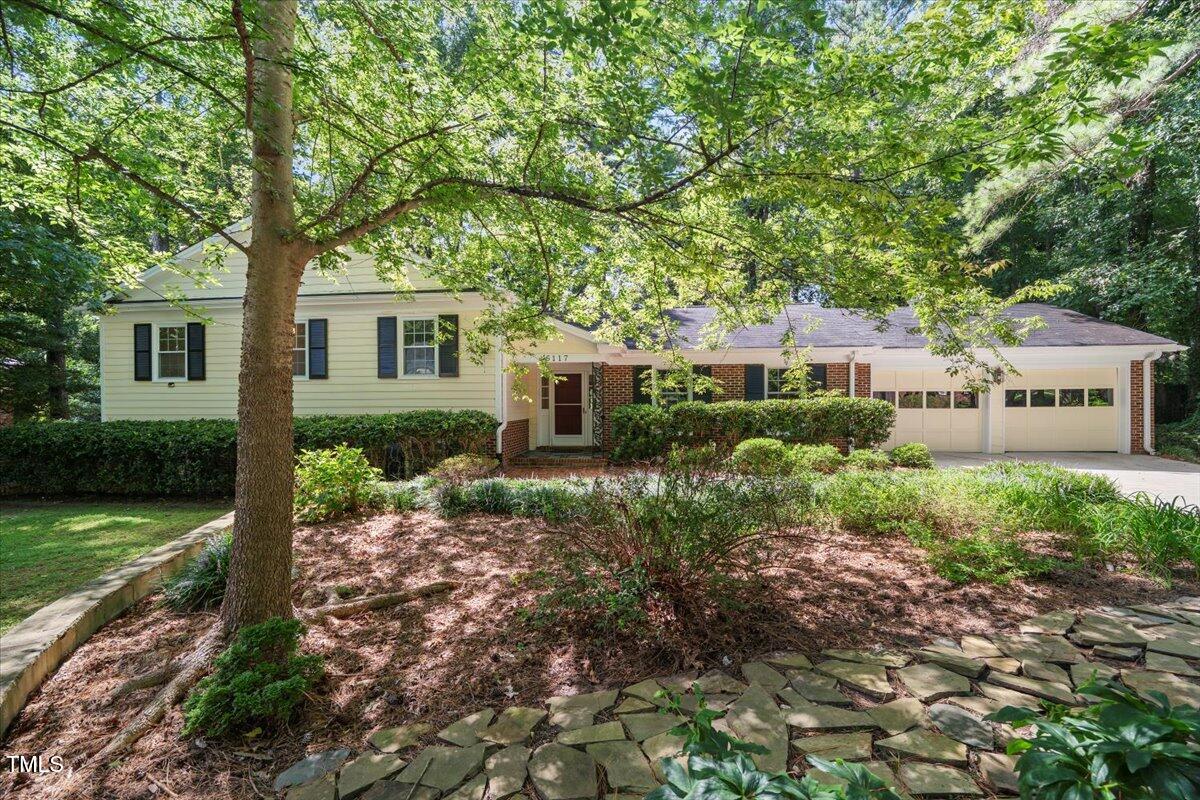 6117 Dodsworth Drive Raleigh, NC 27612 - Photo 1 of 54 front view of a house with a yard