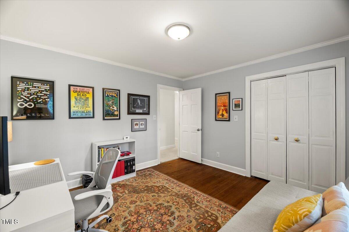 6117 Dodsworth Drive Raleigh, NC 27612 - Photo 20 of 54 a bedroom with furniture and a bed