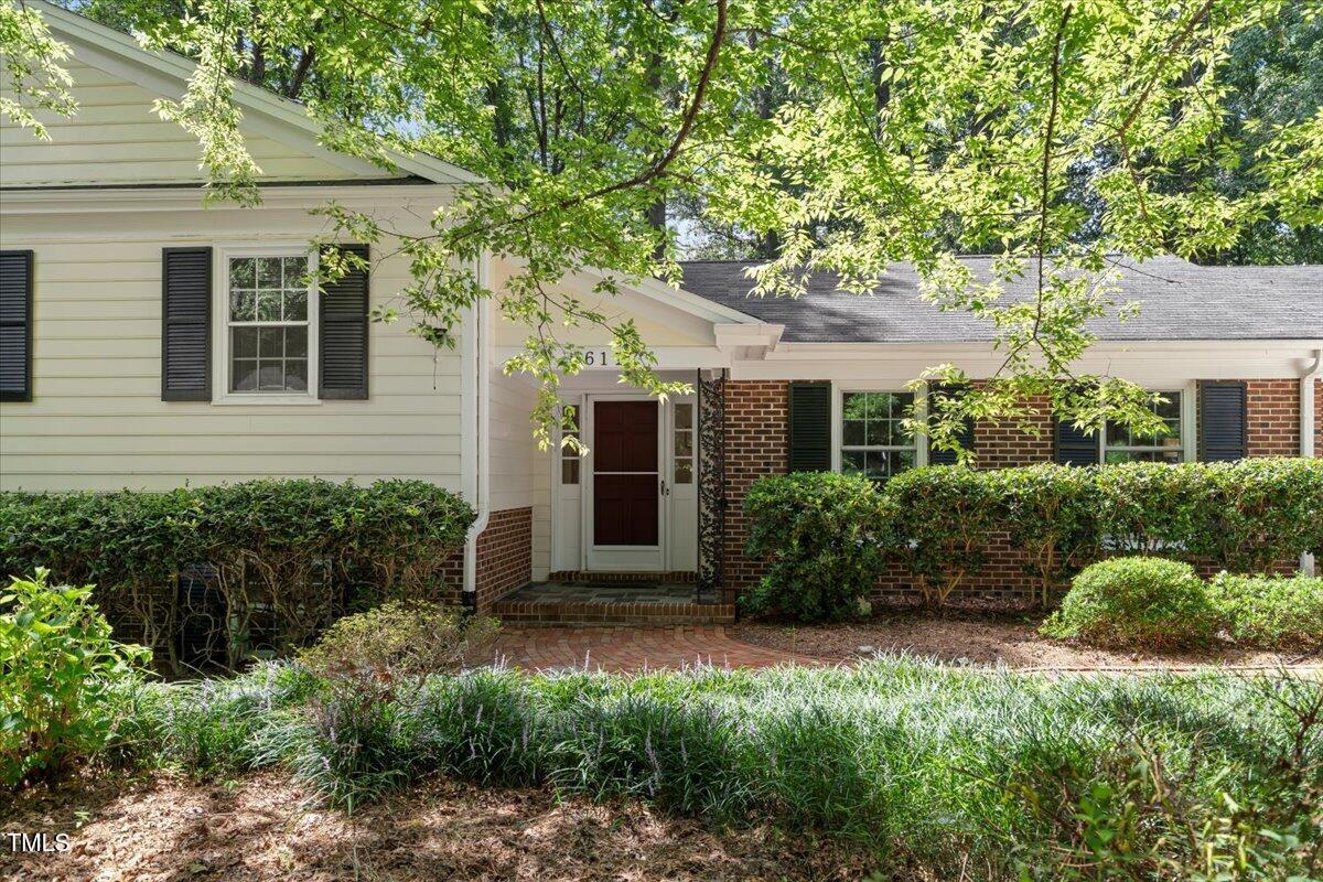 6117 Dodsworth Drive Raleigh, NC 27612 - Photo 2 of 54 a front view of a house with garden