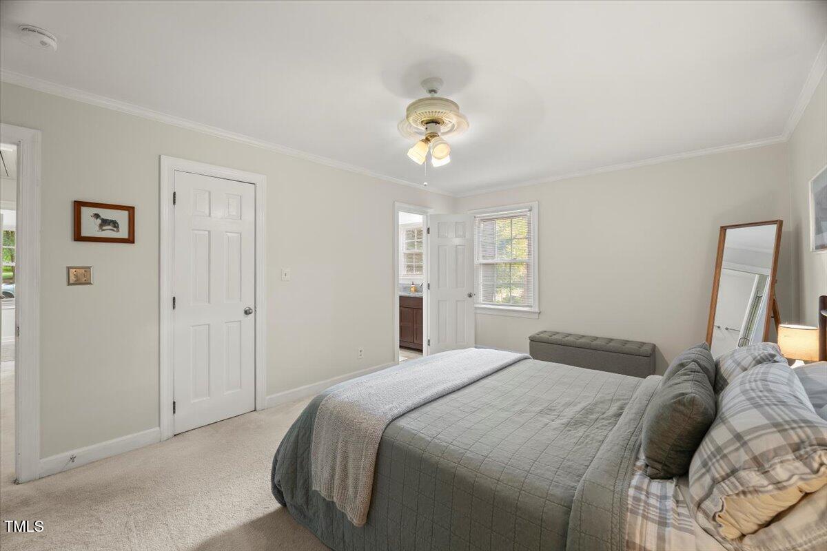 6117 Dodsworth Drive Raleigh, NC 27612 - Photo 22 of 54 a bedroom with a bed and a window