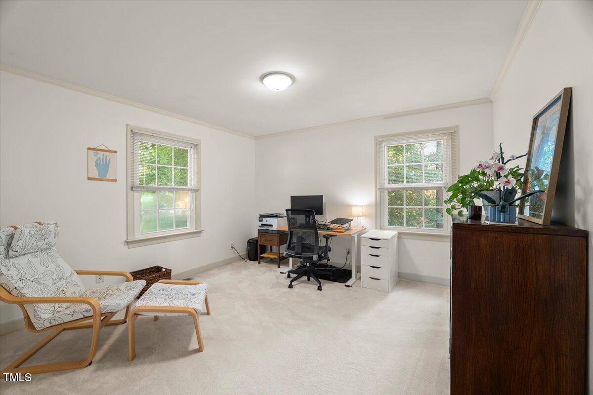 6117 Dodsworth Drive Raleigh, NC 27612 - Photo 25 of 54 a workspace with furniture a potted plant and a window
