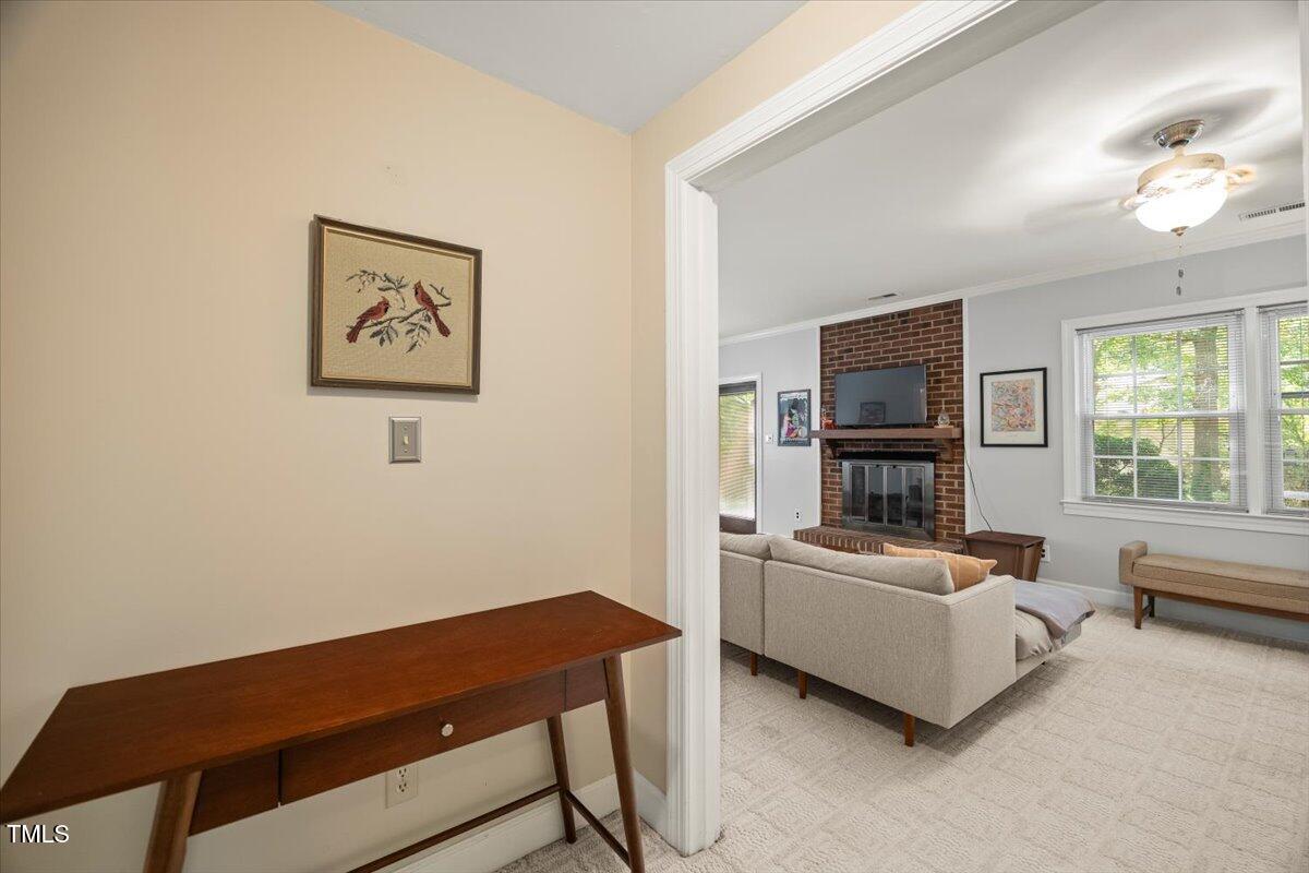 6117 Dodsworth Drive Raleigh, NC 27612 - Photo 30 of 54 a living room with furniture and a flat screen tv