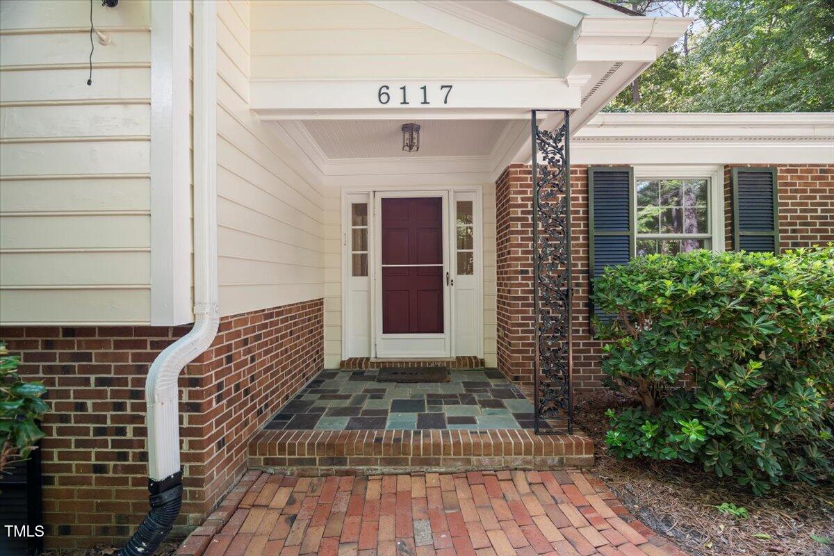 6117 Dodsworth Drive Raleigh, NC 27612 - Photo 3 of 54 a front view of a house with a yard