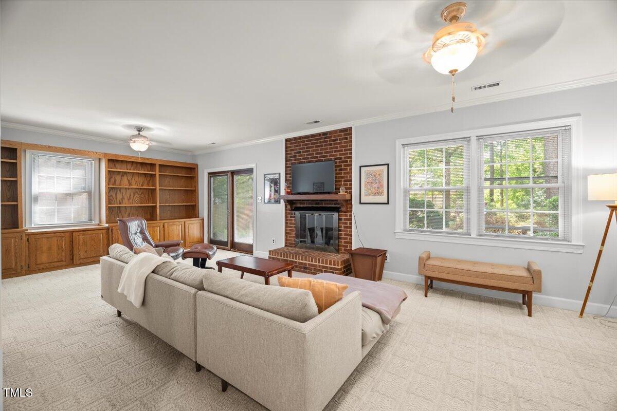6117 Dodsworth Drive Raleigh, NC 27612 - Photo 31 of 54 a living room with furniture and a large window
