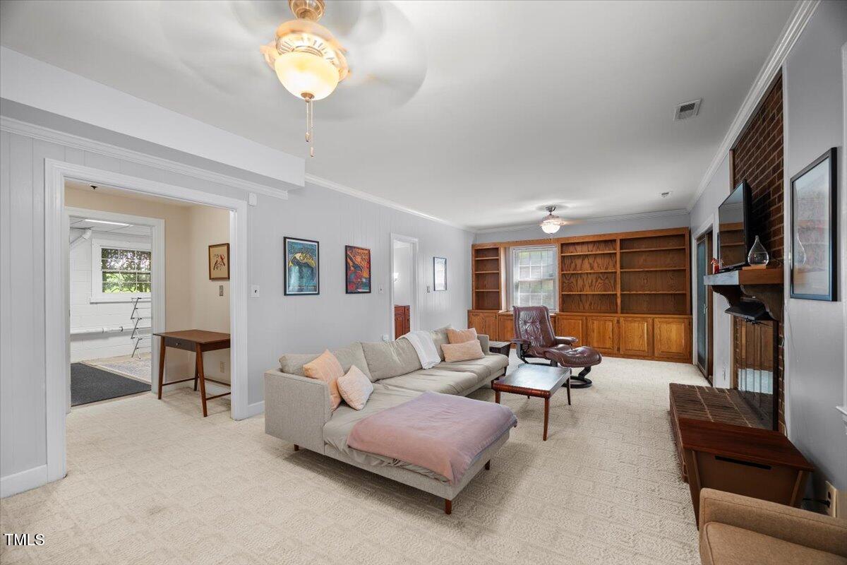 6117 Dodsworth Drive Raleigh, NC 27612 - Photo 32 of 54 a living room with furniture and a window