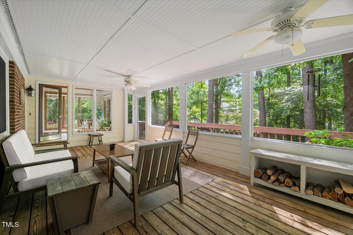 6117 Dodsworth Drive Raleigh, NC 27612 - Photo 40 of 54 a dining room with furniture a chandelier and wooden floor