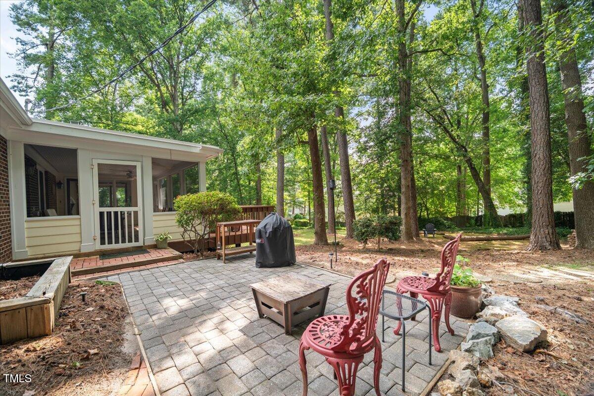 6117 Dodsworth Drive Raleigh, NC 27612 - Photo 42 of 54 a view of backyard with patio