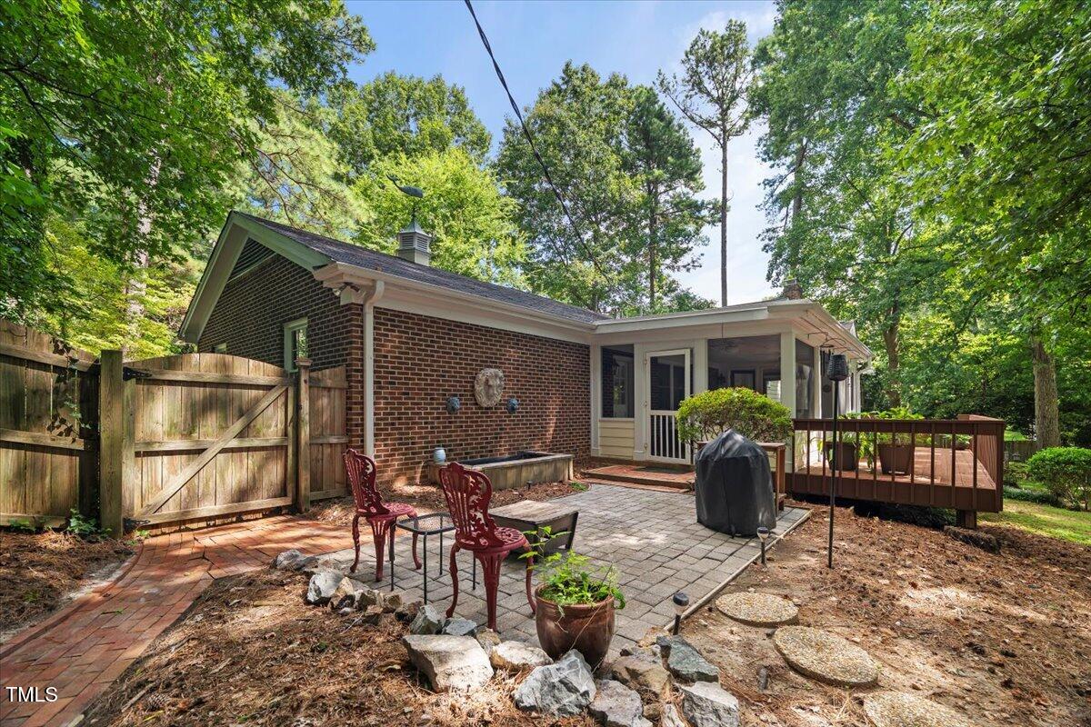 6117 Dodsworth Drive Raleigh, NC 27612 - Photo 43 of 54 a view of a house with backyard and sitting area