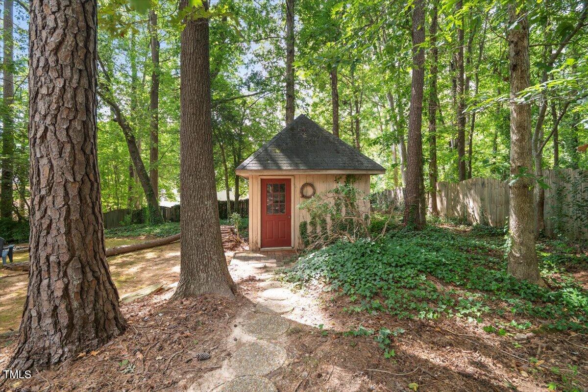 6117 Dodsworth Drive Raleigh, NC 27612 - Photo 44 of 54 a front view of a house with garden