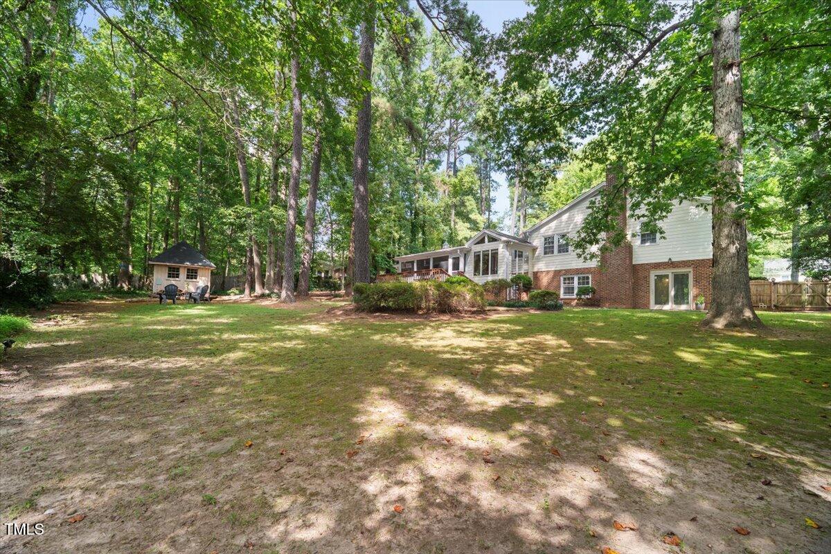 6117 Dodsworth Drive Raleigh, NC 27612 - Photo 47 of 54 a view of yard with swimming pool and green space