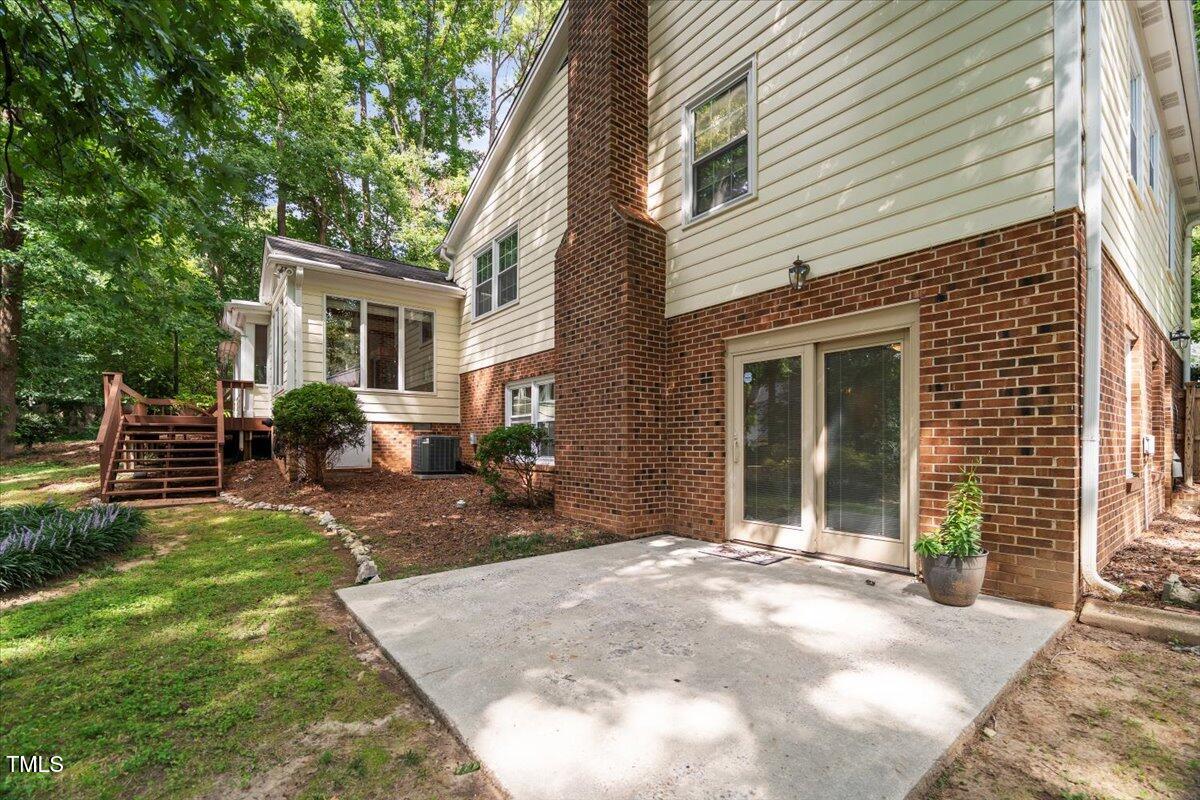 6117 Dodsworth Drive Raleigh, NC 27612 - Photo 49 of 54 a view of a house with backyard and sitting area