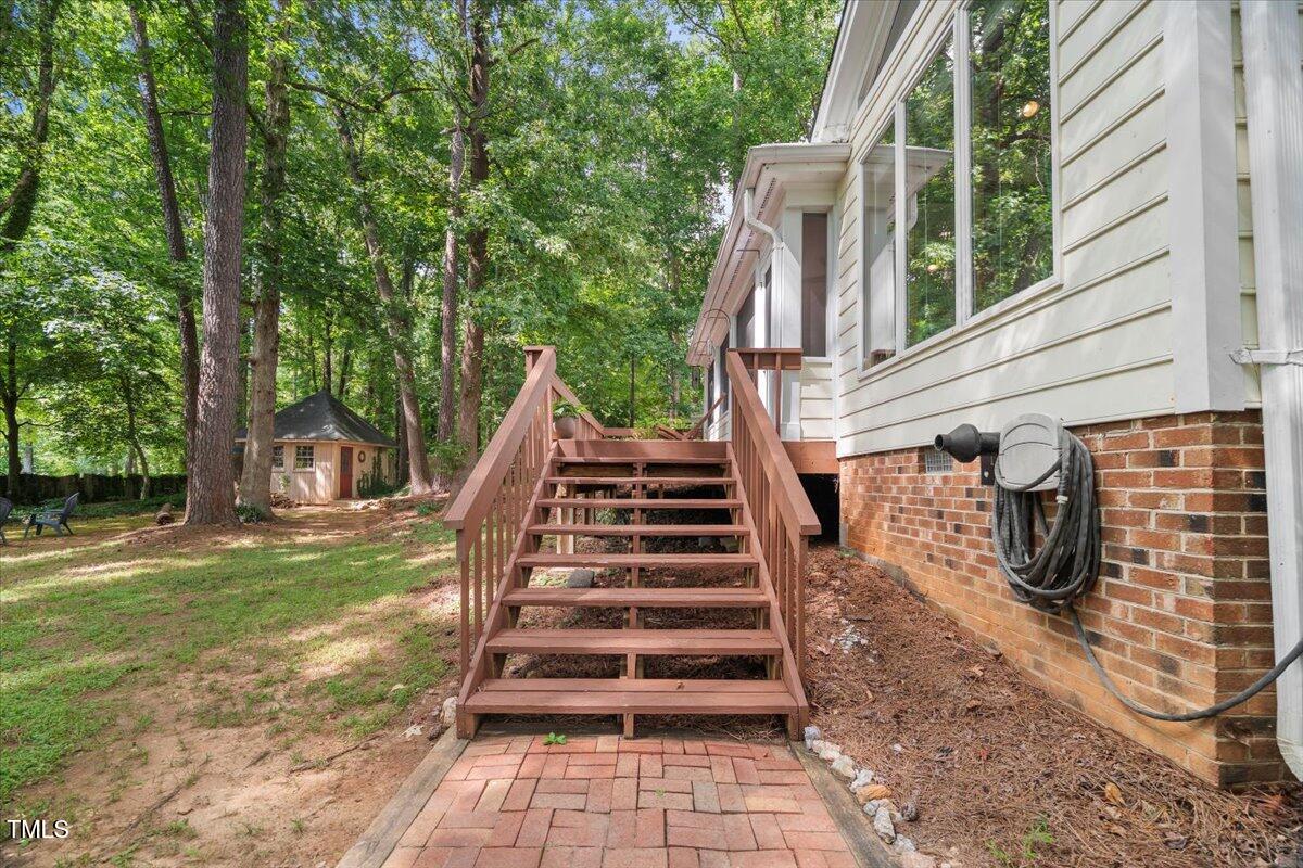 6117 Dodsworth Drive Raleigh, NC 27612 - Photo 50 of 54 a view of a backyard with stairs