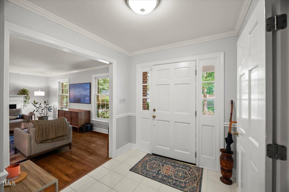 6117 Dodsworth Drive Raleigh, NC 27612 - Photo 5 of 54 a living room with furniture and a rug