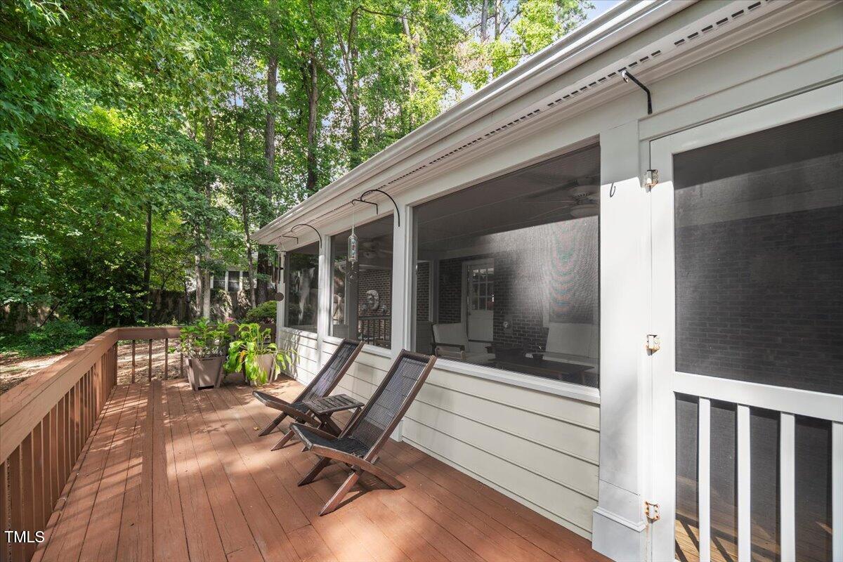 6117 Dodsworth Drive Raleigh, NC 27612 - Photo 51 of 54 a view of backyard with a deck and wooden floor