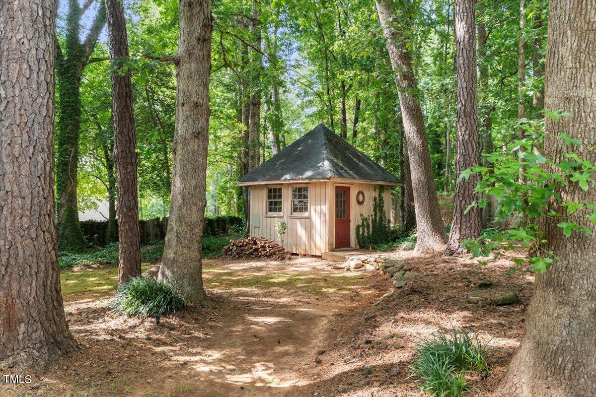 6117 Dodsworth Drive Raleigh, NC 27612 - Photo 53 of 54 a front view of a house with a yard