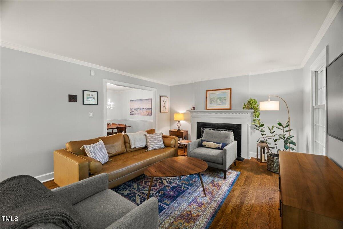 6117 Dodsworth Drive Raleigh, NC 27612 - Photo 7 of 54 a living room with furniture and a fireplace