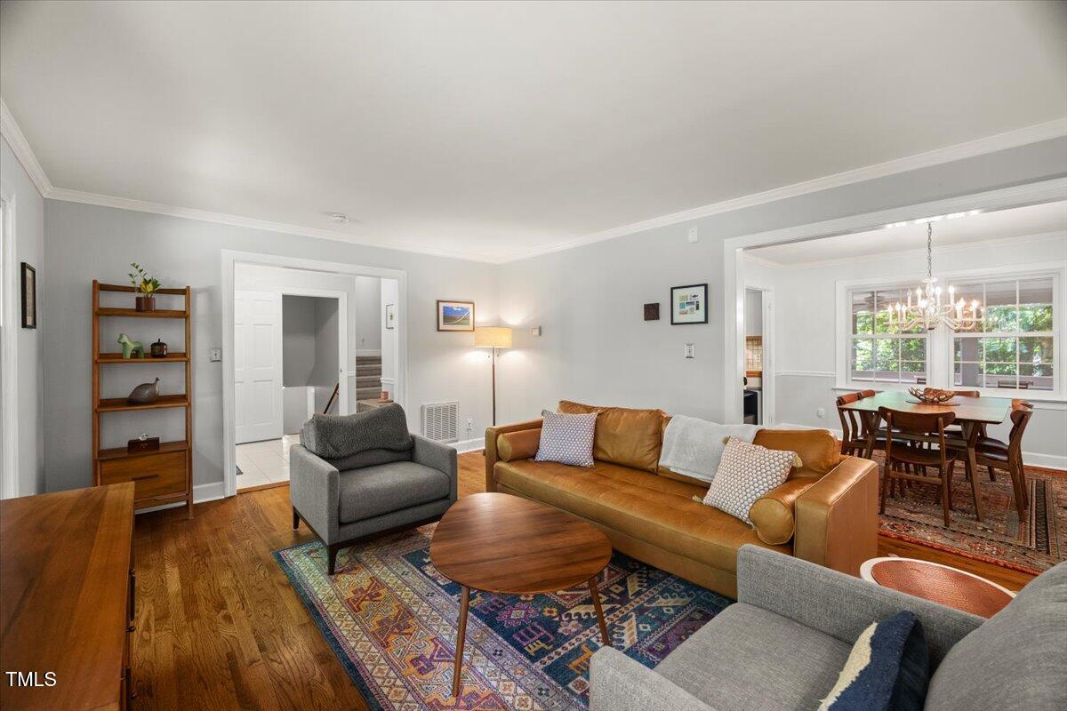 6117 Dodsworth Drive Raleigh, NC 27612 - Photo 8 of 54 a living room with furniture and wooden floor