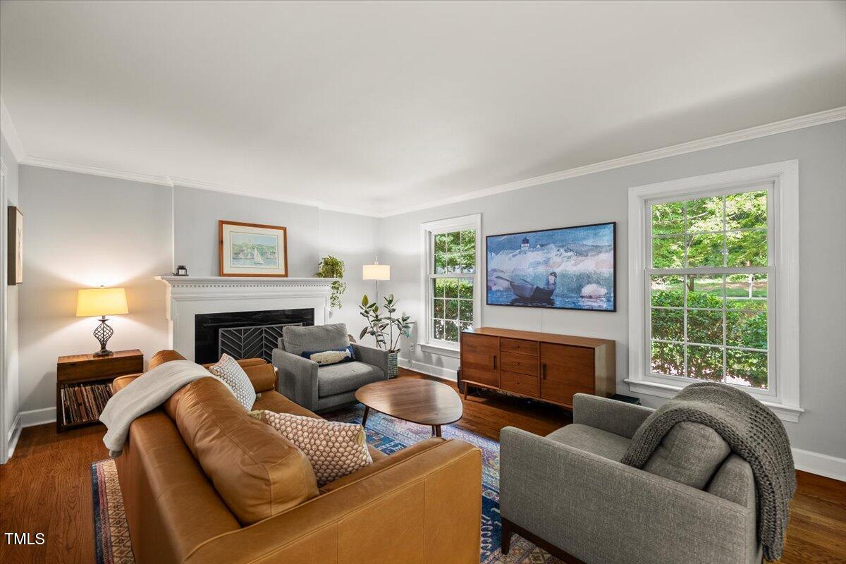 6117 Dodsworth Drive Raleigh, NC 27612 - Photo 9 of 54 a living room with furniture and a fireplace
