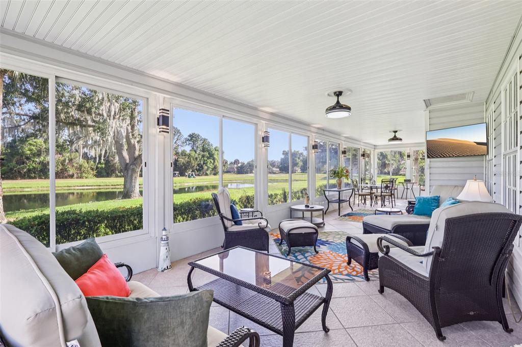 587 Juniper Way Tavares, FL 32778 - Photo 17 of 56 a living room with furniture and a large window