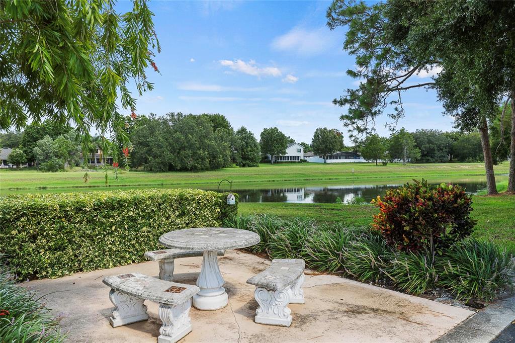 587 Juniper Way Tavares, FL 32778 - Photo 56 of 56 a view of a garden with an outdoor seating