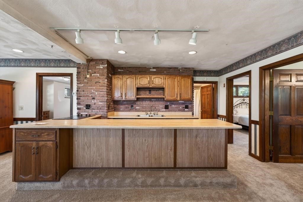 38 Gaudette Street Fall River, MA 02721 - Photo 36 of 41 a large kitchen with kitchen island a large island in the center