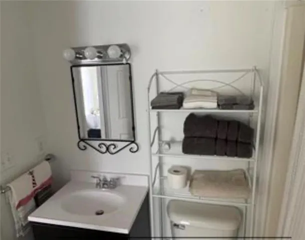 a bathroom with a sink and mirror