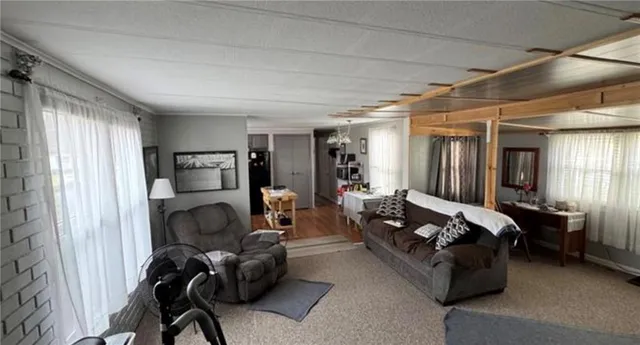 a bed room with furniture and a window