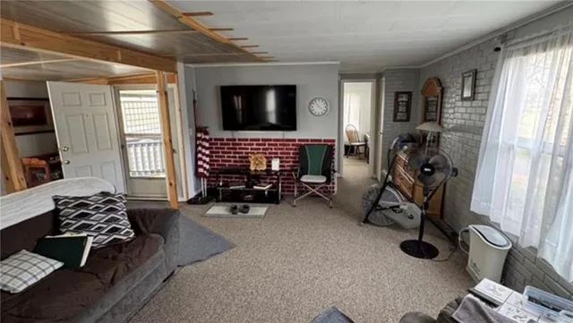 a bedroom with furniture and a window