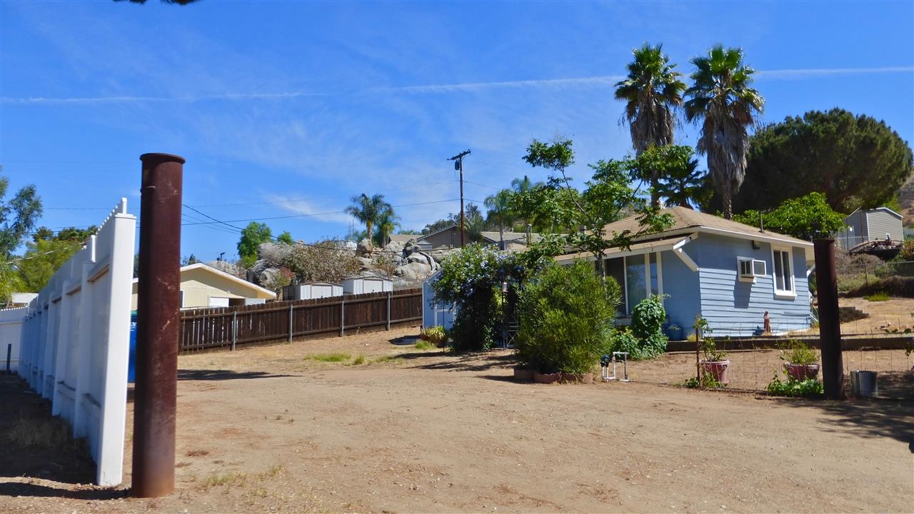 10455-59 Valle Vista Road Lakeside, CA 92040 - Photo 12 of 20 Exterior Front of the Cottage from the vantage point of the White Vinyl Fence!.. Don't miss this adorable cottage!