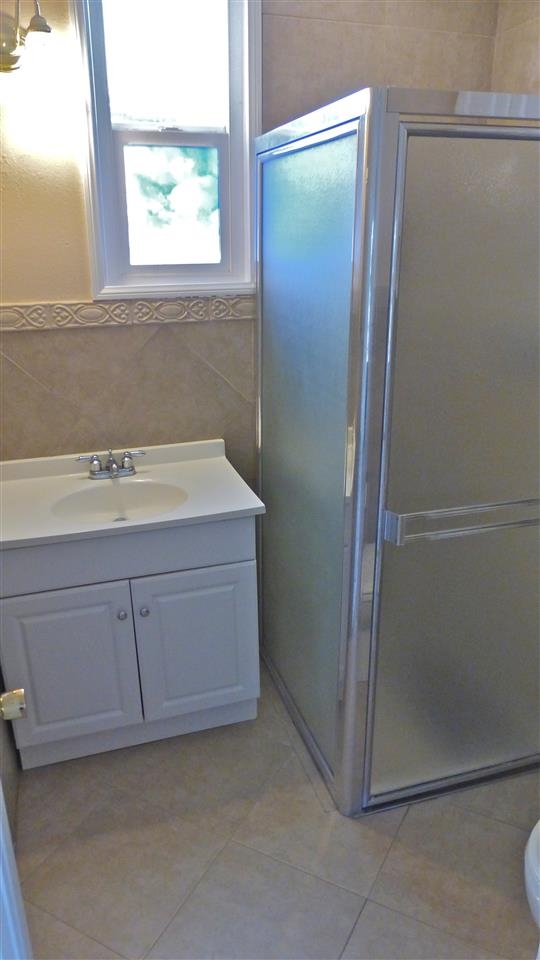 10455-59 Valle Vista Road Lakeside, CA 92040 - Photo 18 of 20 3/4 Bathroom in 1 BR Unit has beautiful tile work in the shower and on the walls.