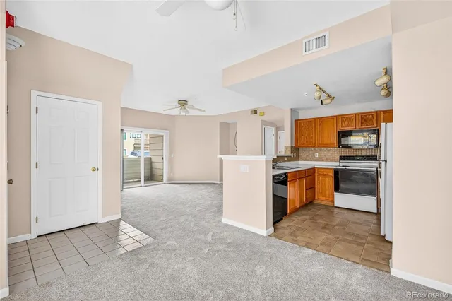 a kitchen with a sink stove and microwave