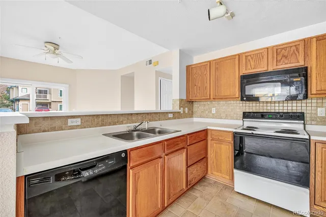a kitchen with a sink and a window