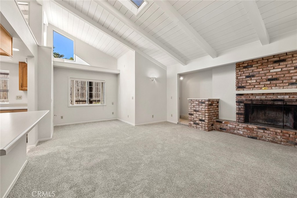 4821 Hampton Road La Canada Flintridge, CA 91011 - Photo 11 of 36 a view of a livingroom with an empty space and a fireplace